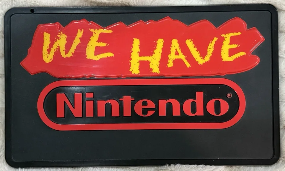 Our photograph of a vintage We Have Nintendo store display sign